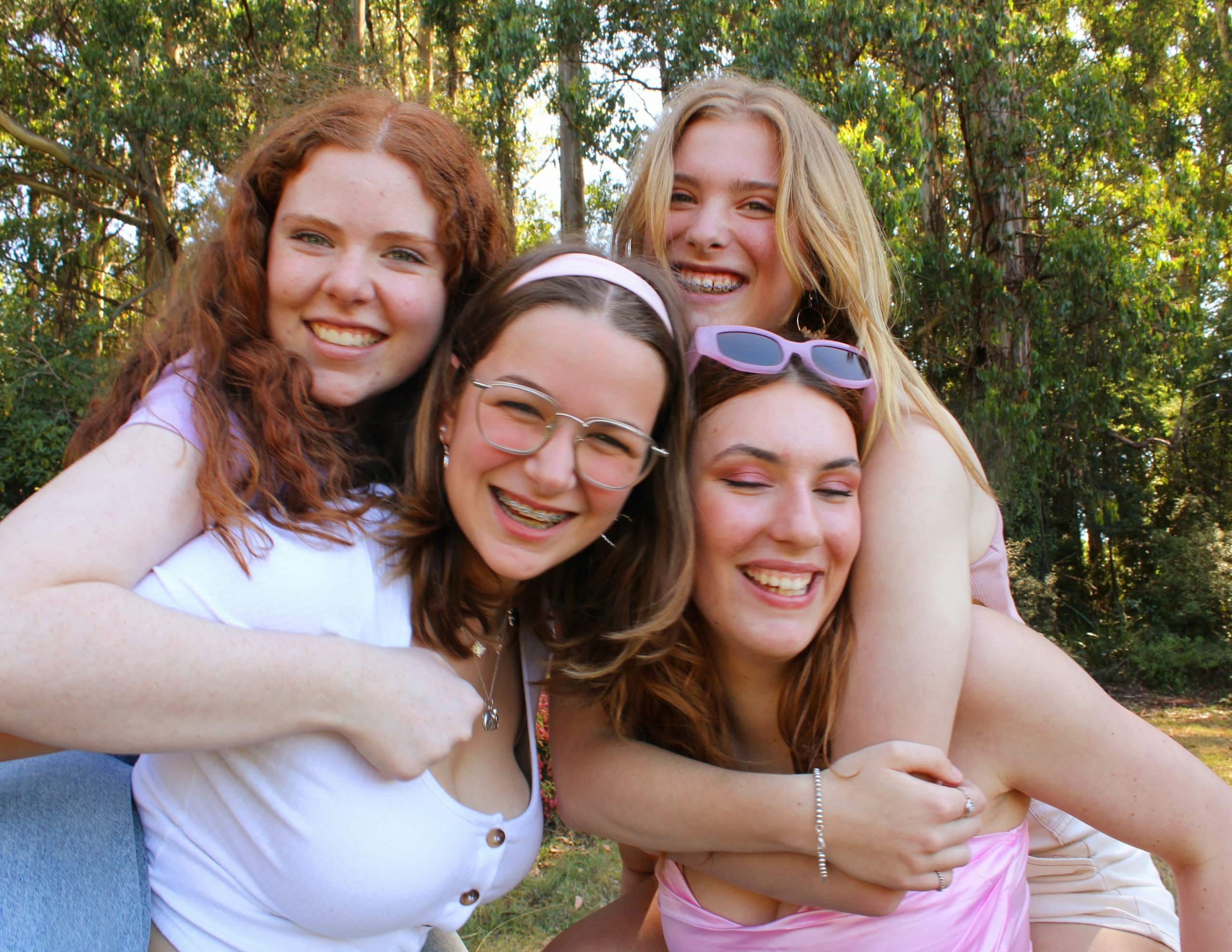 a group of young women hugging each other